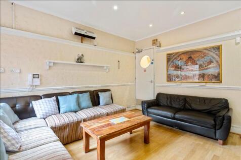 Spacious living room featuring comfortable seat...