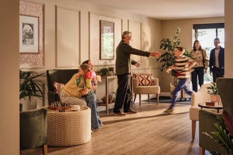 a group of people in a living room