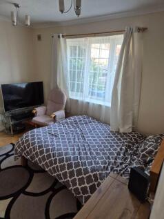 Bright double bedroom with a large window...