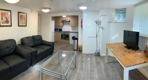 Bright, modern living area with a comfortable s...