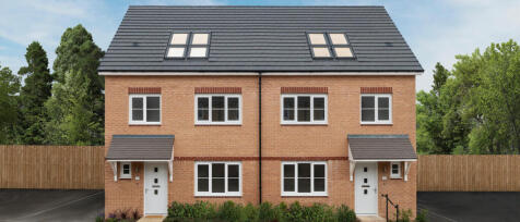 Two new semi-detached brick houses with slate roofs, white-framed windows, and small porches in a gr