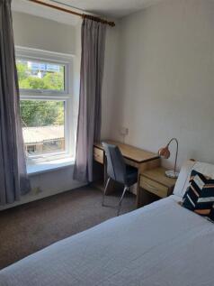 Bright bedroom with dedicated study workspace...