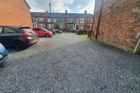 A spacious view of the front vehicle parking ar...