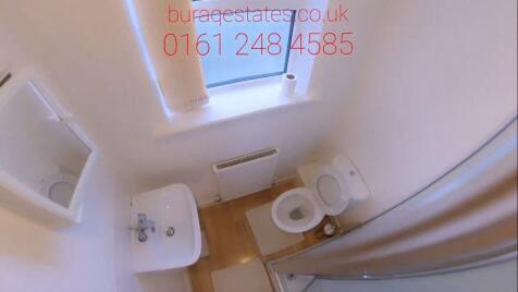 Bright bathroom with window and modern fixtures...