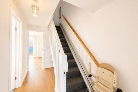 Bright and tidy hallway with sleek flooring...