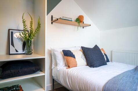 A stylish and inviting double bedroom with mode...