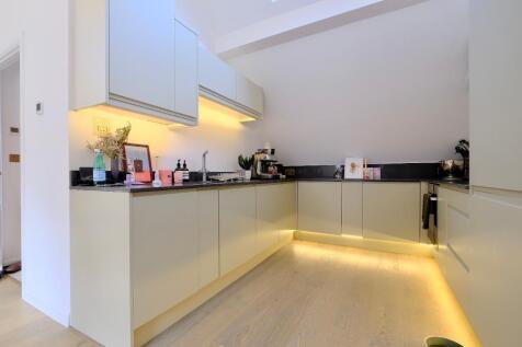 Kitchen with fitted appliances