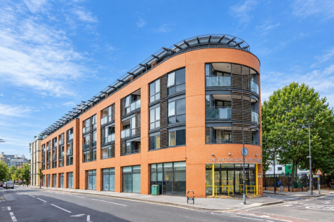 Modern Curved-Corner Brick and Glass Building.png