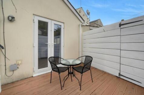 Private decked patio with stylish bistro set...