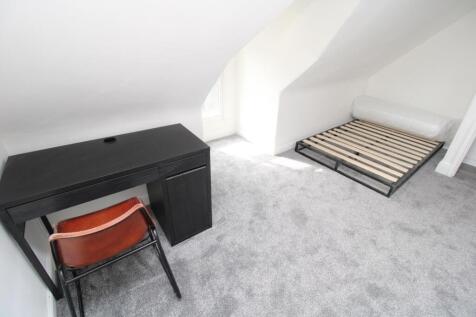 Bright modern bedroom with dedicated study desk...