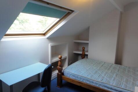 Bright and welcoming double bedroom with a slop...
