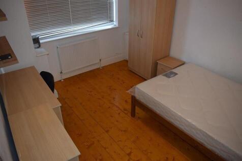 Neat single bedroom with a double bed frame, li...