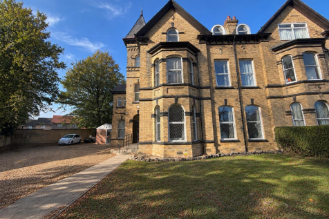Victorian House with Driveway and Lawn.png