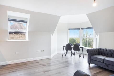 Bright open living area with scenic bay window...