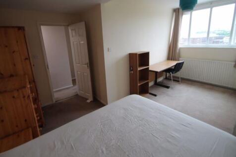 Bright and spacious master bedroom featuring a ...