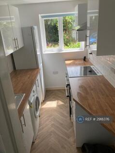 New Kitchen With Washer And Fridge And Oven