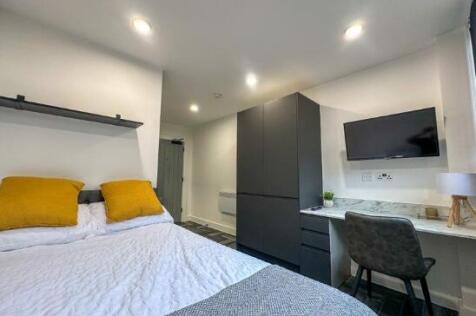 A modern double bedroom featuring a comfortable...