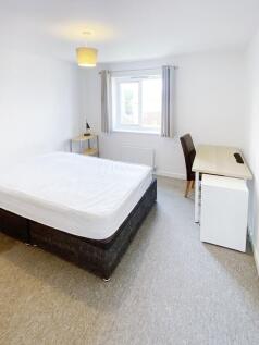 Bright, freshly decorated double bedroom with a...