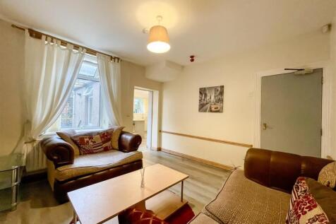 Bright and social living area with plush sofas...