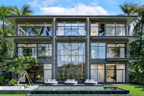 Modern three-story home with expansive glass windo