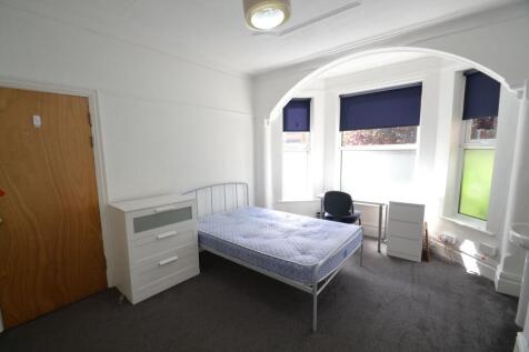 Bright and well-maintained bedroom featuring a ...