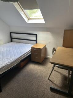 Bright bedroom with skylight and study desk...