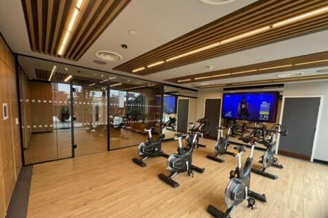 Modern gym with spin bikes and sleek design....