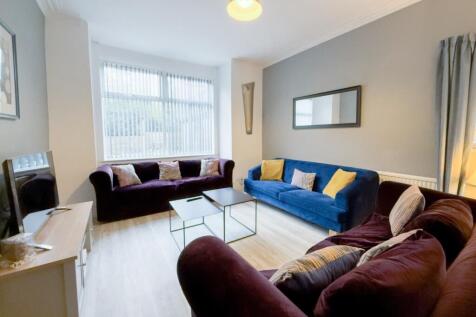 Bright, modern lounge with comfy sofas...