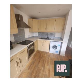 A modern, well-equipped kitchen featuring ample...