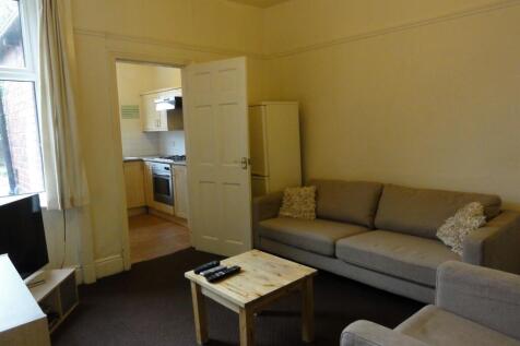 A cozy and inviting living room featuring a com...