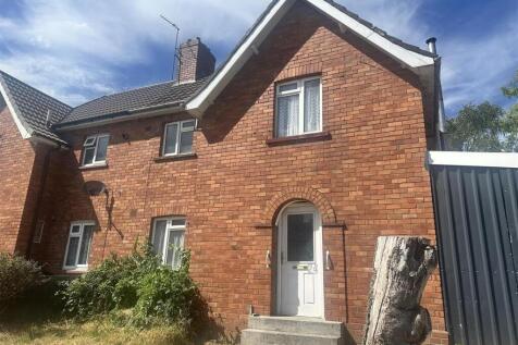 Charming red brick semi-detached house exterior...