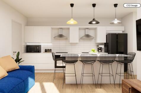 Bright modern kitchen with breakfast bar seatin...