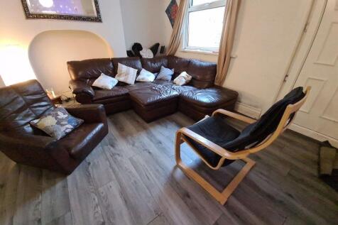 A spacious and inviting living room featuring c...