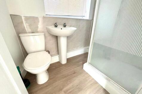 A modern and clean bathroom featuring a refresh...