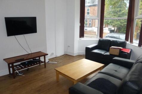 Bright, well-kept living room with large bay wi...