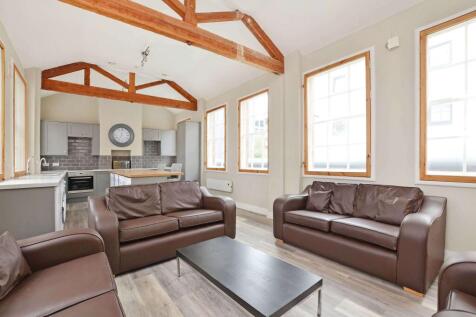 Bright and airy living room featuring multiple ...