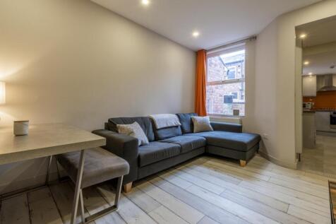 Modern living area with a comfortable corner so...