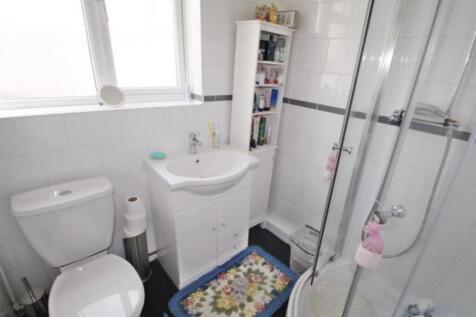 Bright, well-kept bathroom with a corner shower...