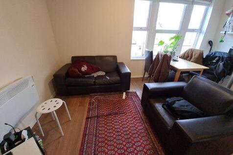 A bright and inviting living room featuring a c...