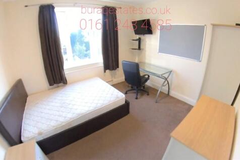 Bright, simply furnished double bedroom with a ...