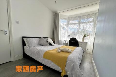A bright and inviting double bedroom featuring ...
