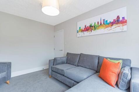 A stylish and inviting living room featuring co...