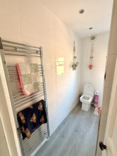 Bright bathroom with modern heated towel rail...