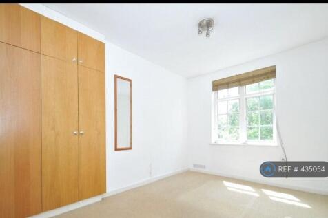 Living Room: Double Bed, Armchair, Table, Chairs