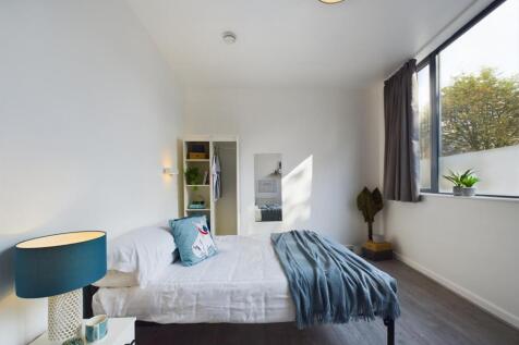 Bright, neatly presented bedroom with a double ...