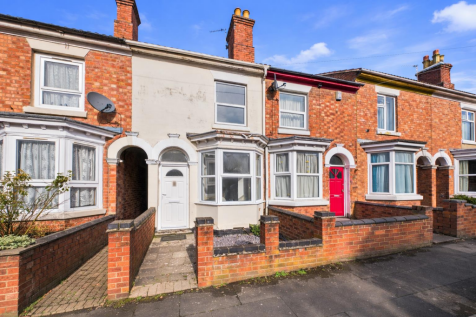 Crisp terraced street with colourful houses.png