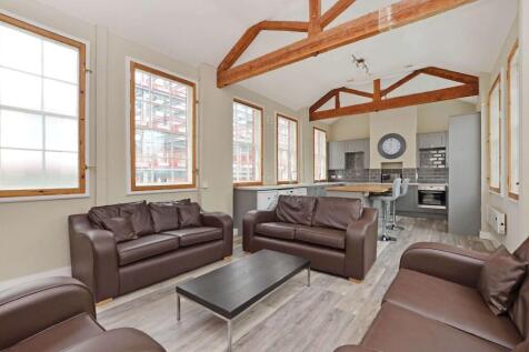 Bright and spacious living room with multiple l...