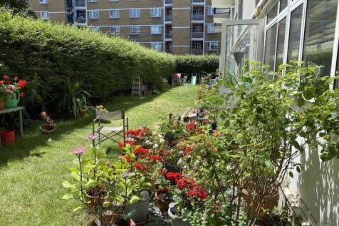 Sun-drenched private lawn with vibrant flowers...