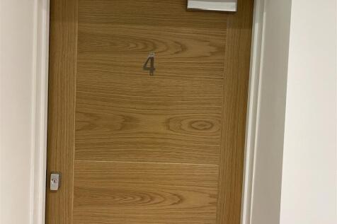 Modern wooden door with secure entry system...