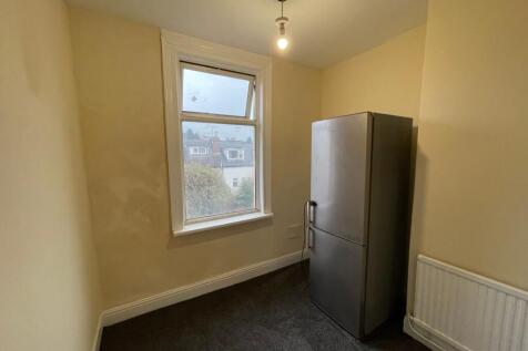 Bright kitchen area with modern fridge freezer...